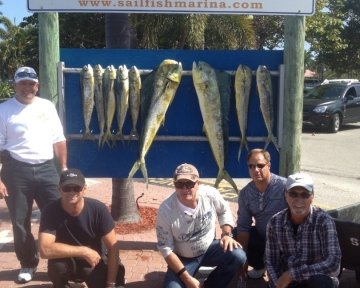 People in front of the sailfish marina sign